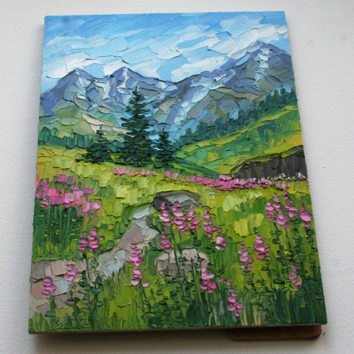 Close-up of impasto texture on Glacier National Park mini painting, bold palette knife strokes