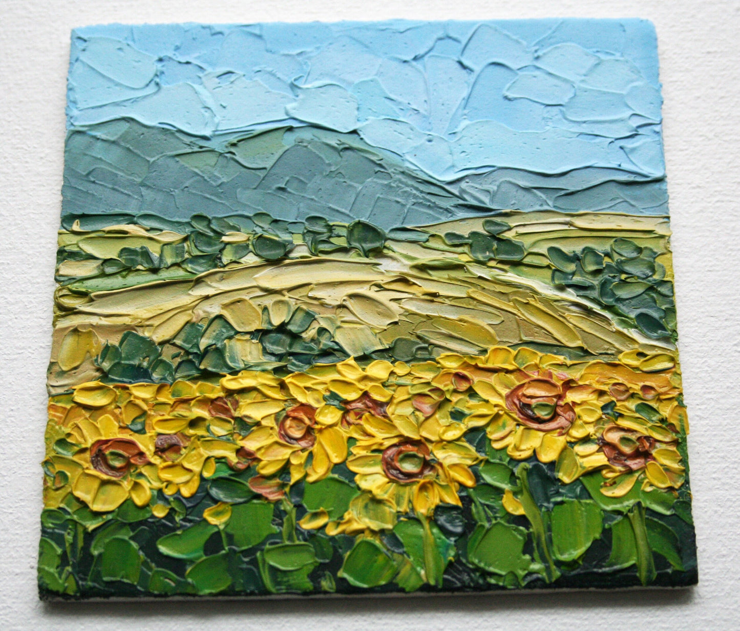 Close-up of impasto texture on Sunflower Field mini painting, bold palette knife strokes