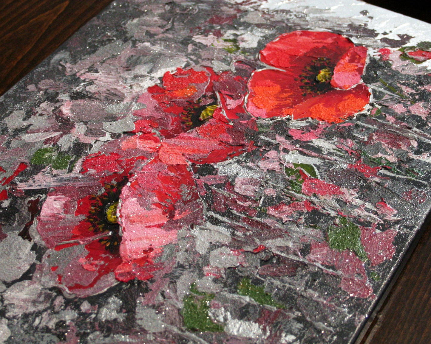 Close-up of textured red poppies painting, acrylic with silver leaf and glitter detail