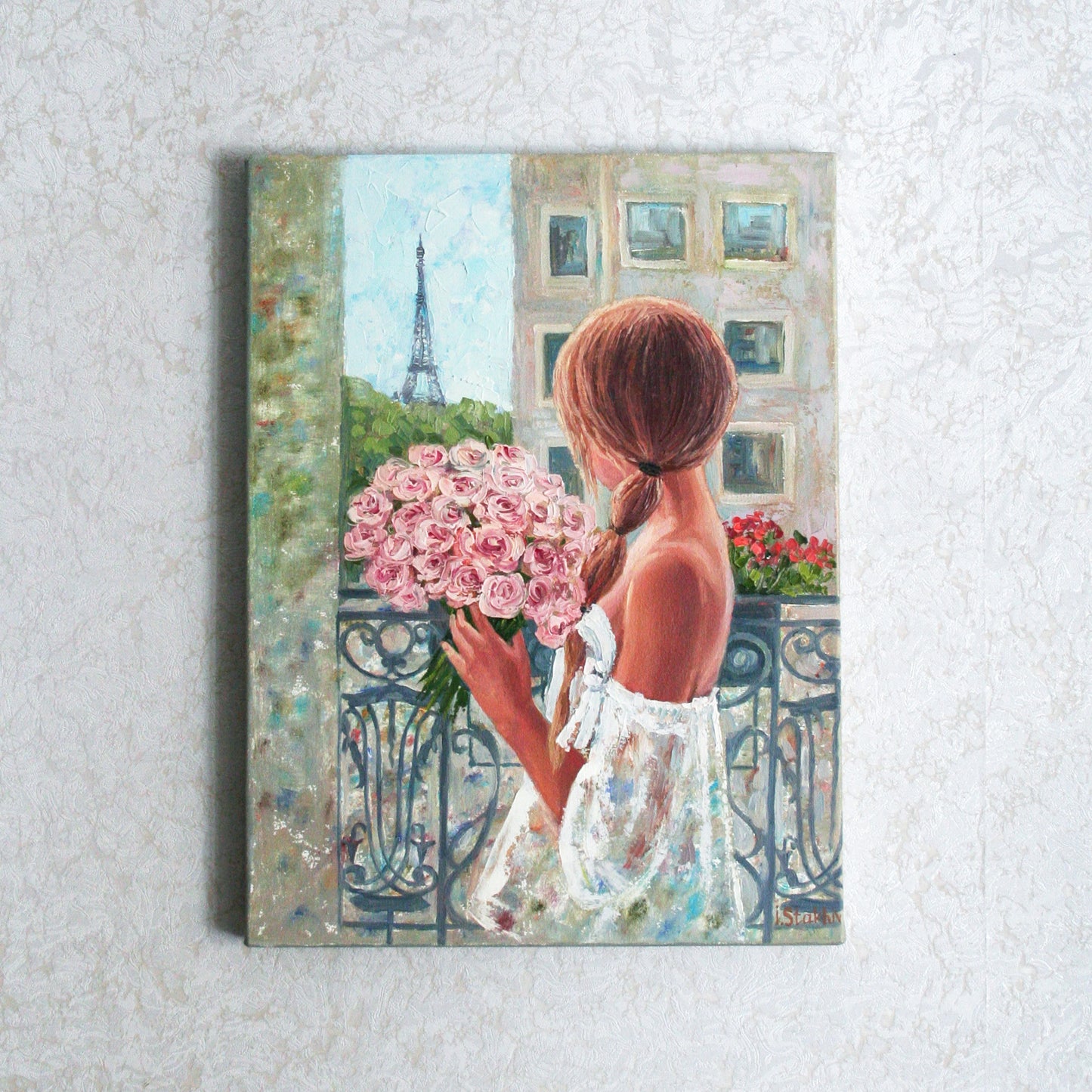 Painting of a woman holding pink flowers with the Eiffel Tower in the background