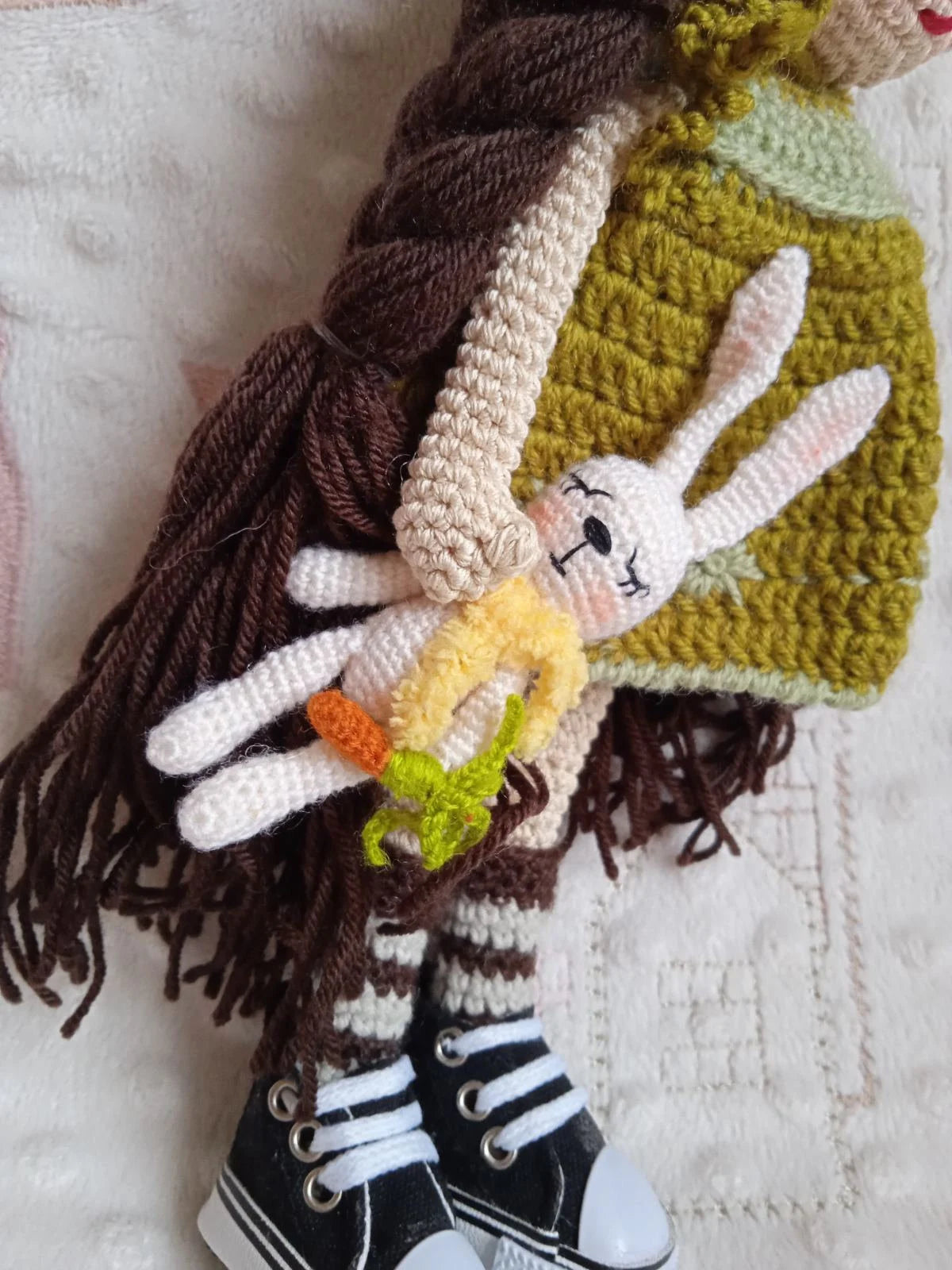 Amigurumi doll with crocheted bunny — removable olive green dress, hat and sneakers, side view