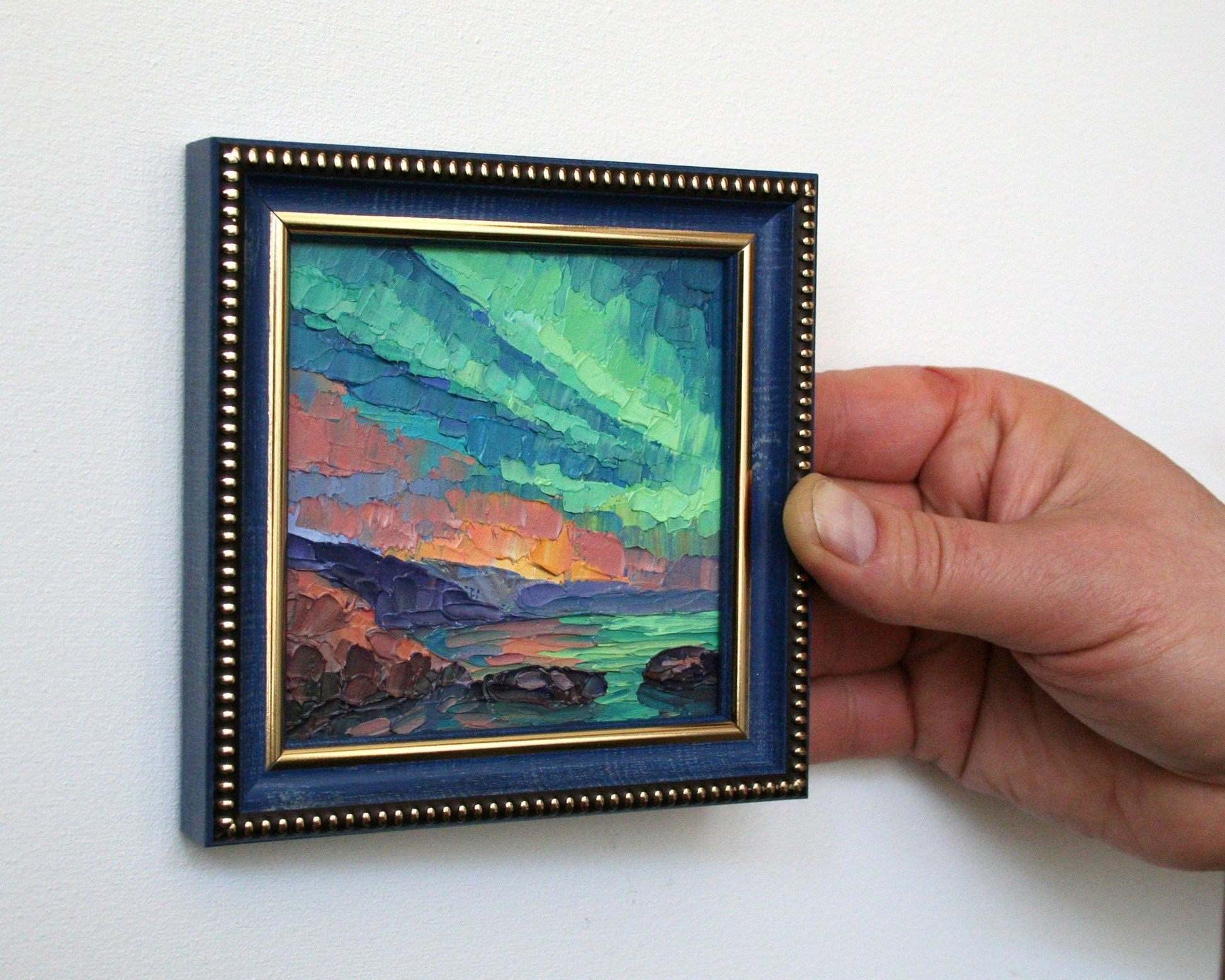 Aurora Borealis mini oil painting in blue frame, northern lights over sea by Iryna Stakhiv