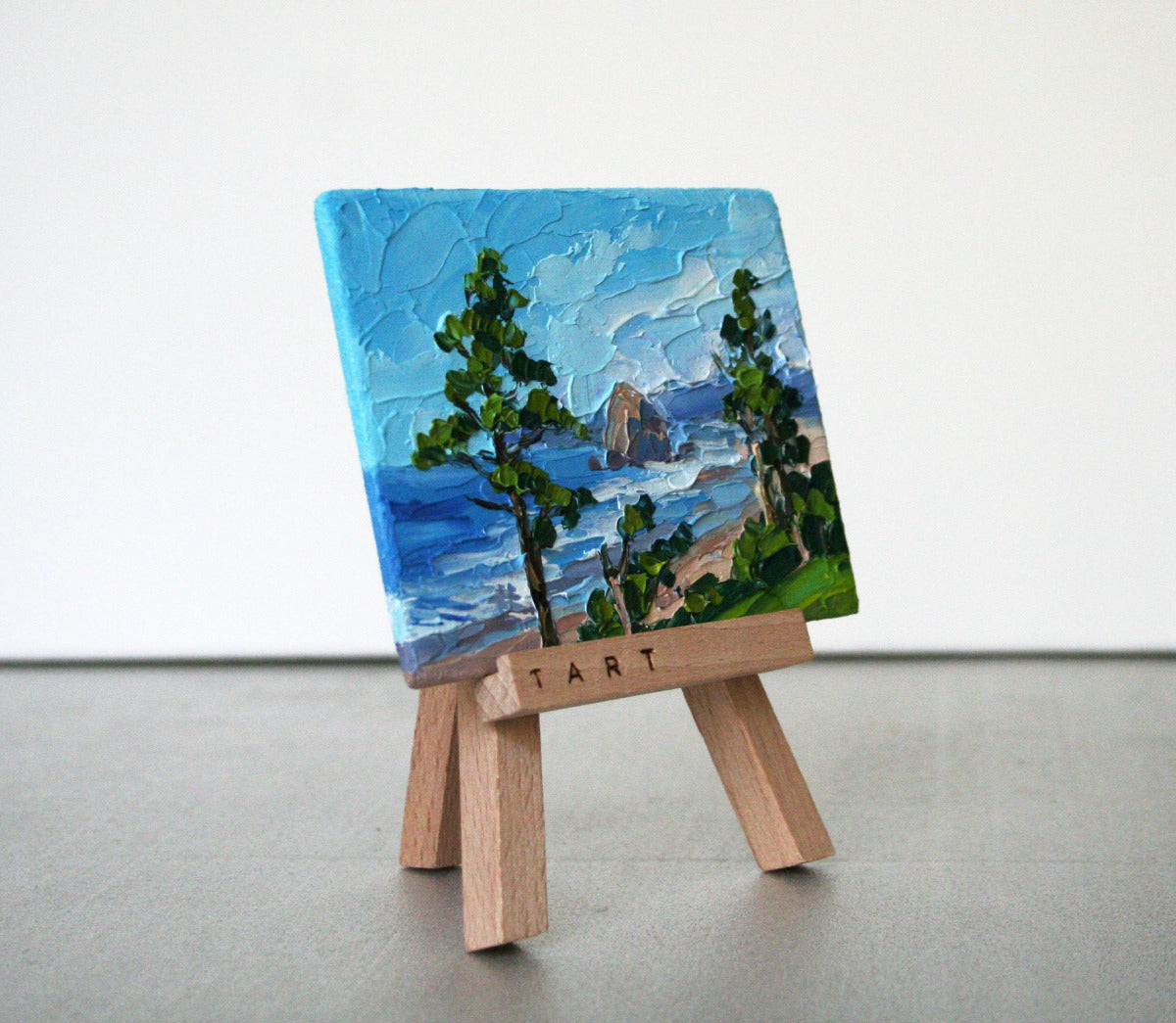 Cannon Beach Oregon original art on easel, impasto palette knife mini painting side view