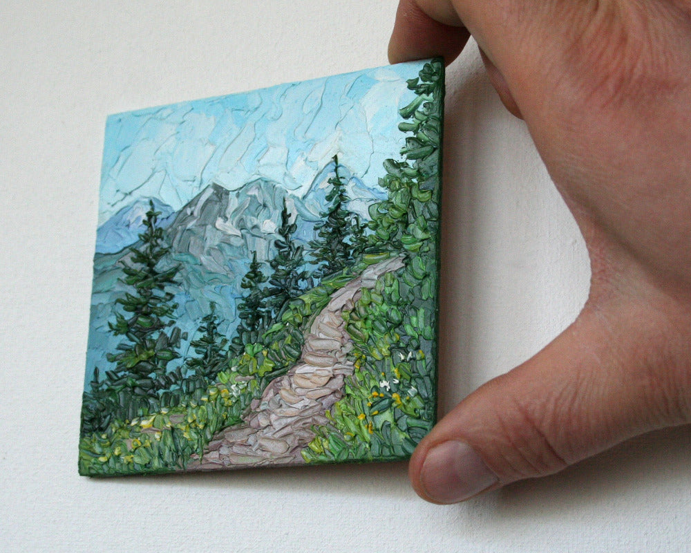 Close-up of impasto texture on Rocky Mountains mini painting, bold palette knife strokes