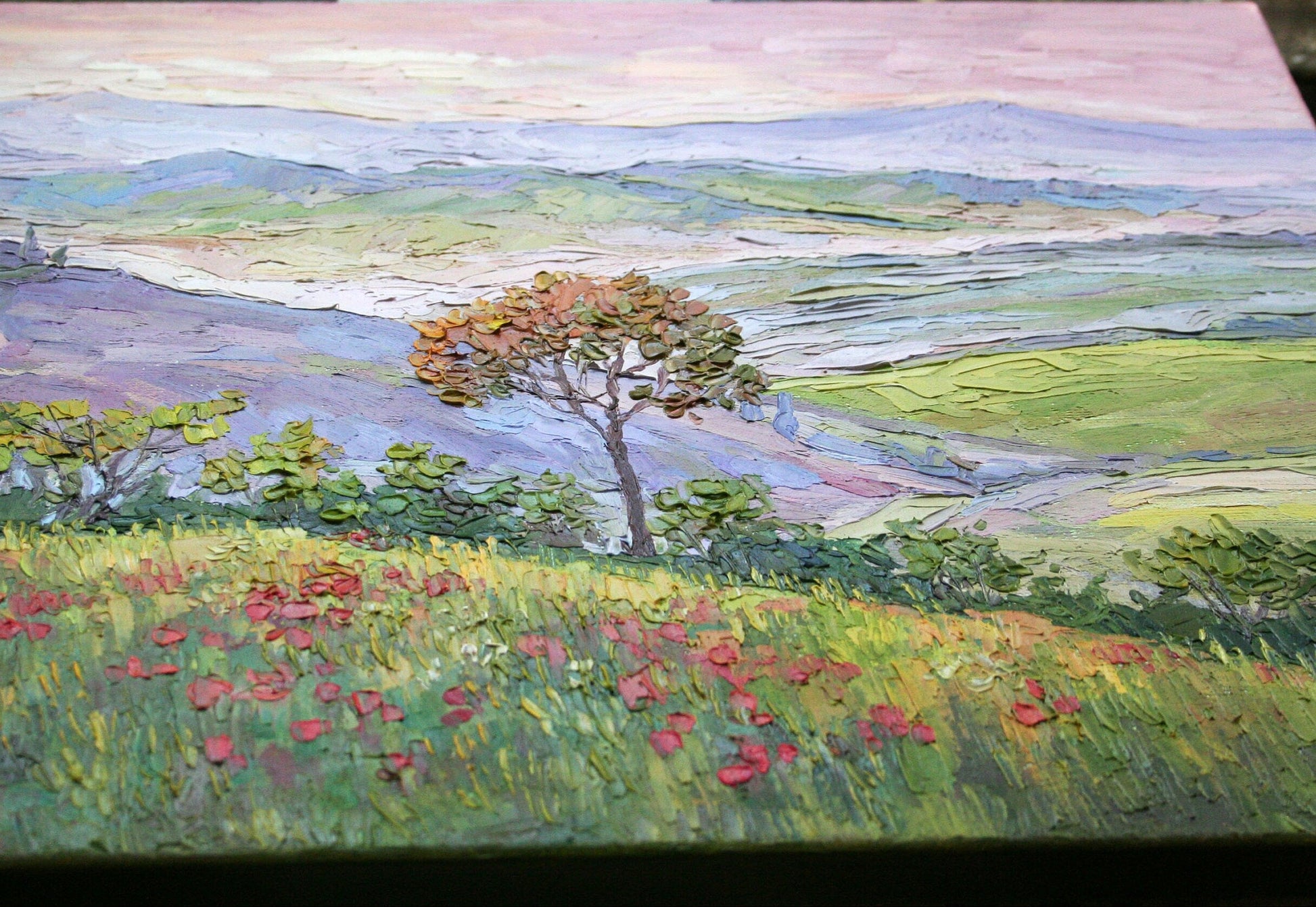 Close-up of impasto texture on Tuscany landscape painting, bold palette knife strokes