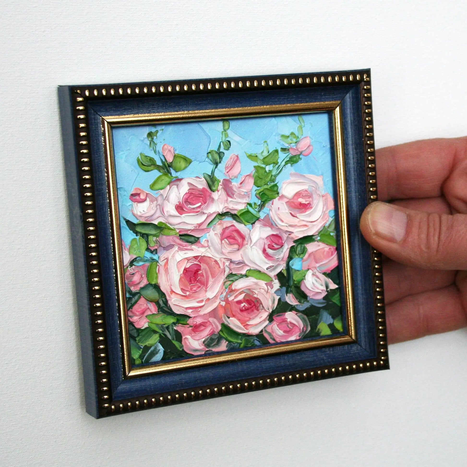 Framed pink rose miniature painting held in hand, palette knife impasto art original