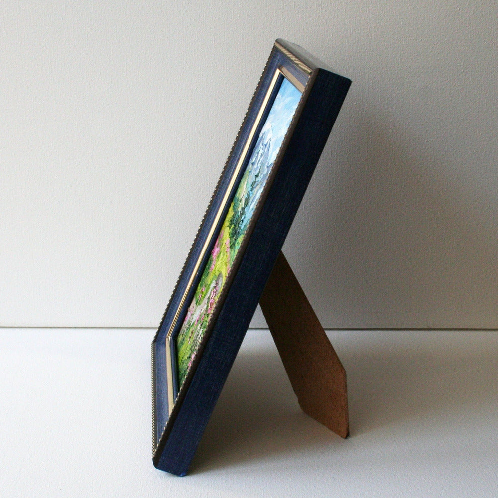Glacier National Park mini oil painting side view in blue frame, painted edges hard panel 13x18 cm