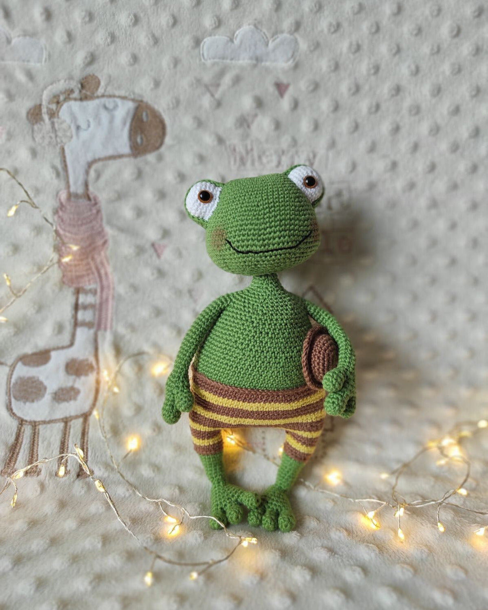Green crochet frog amigurumi stuffed animal, handmade plush toy with poseable wire arms and movable head