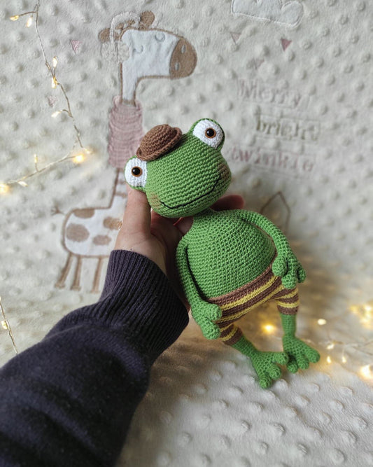 Handmade crochet frog stuffed animal with poseable wire arms, movable head, removable hat