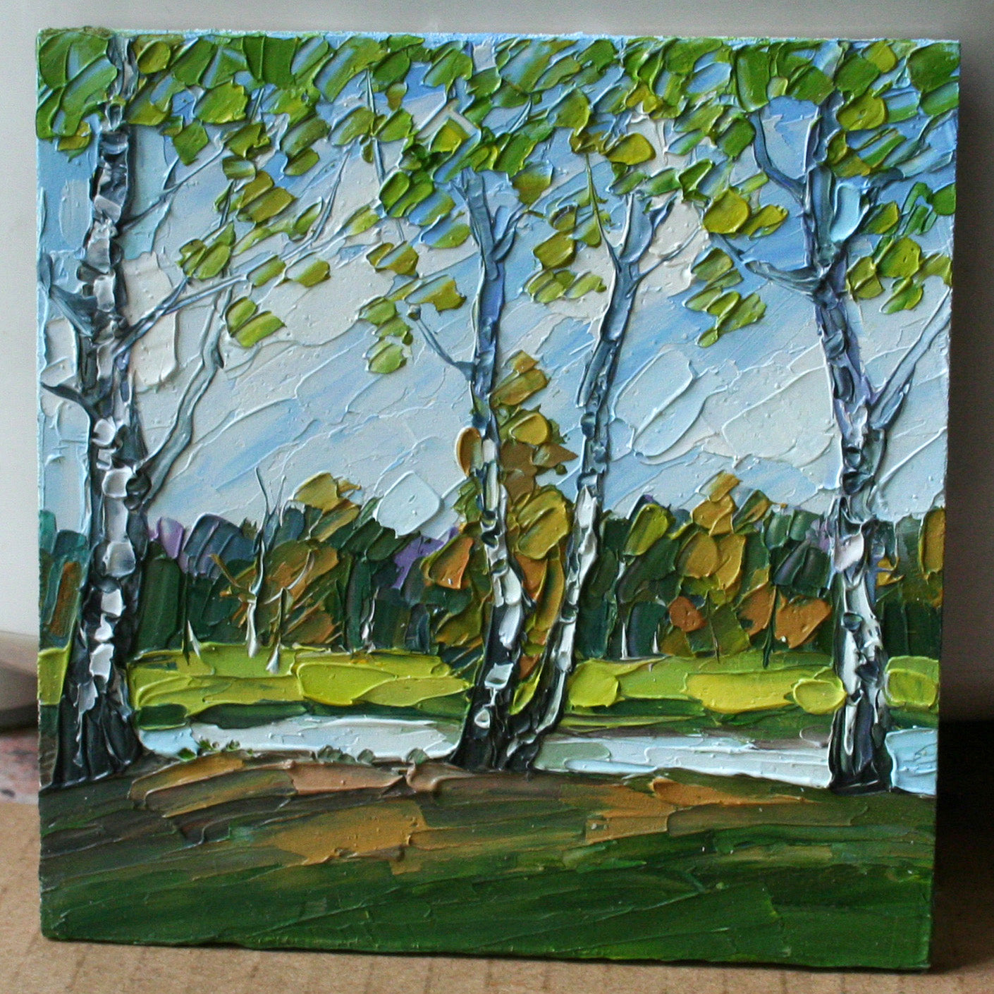 Painting of birch trees and a landscape
