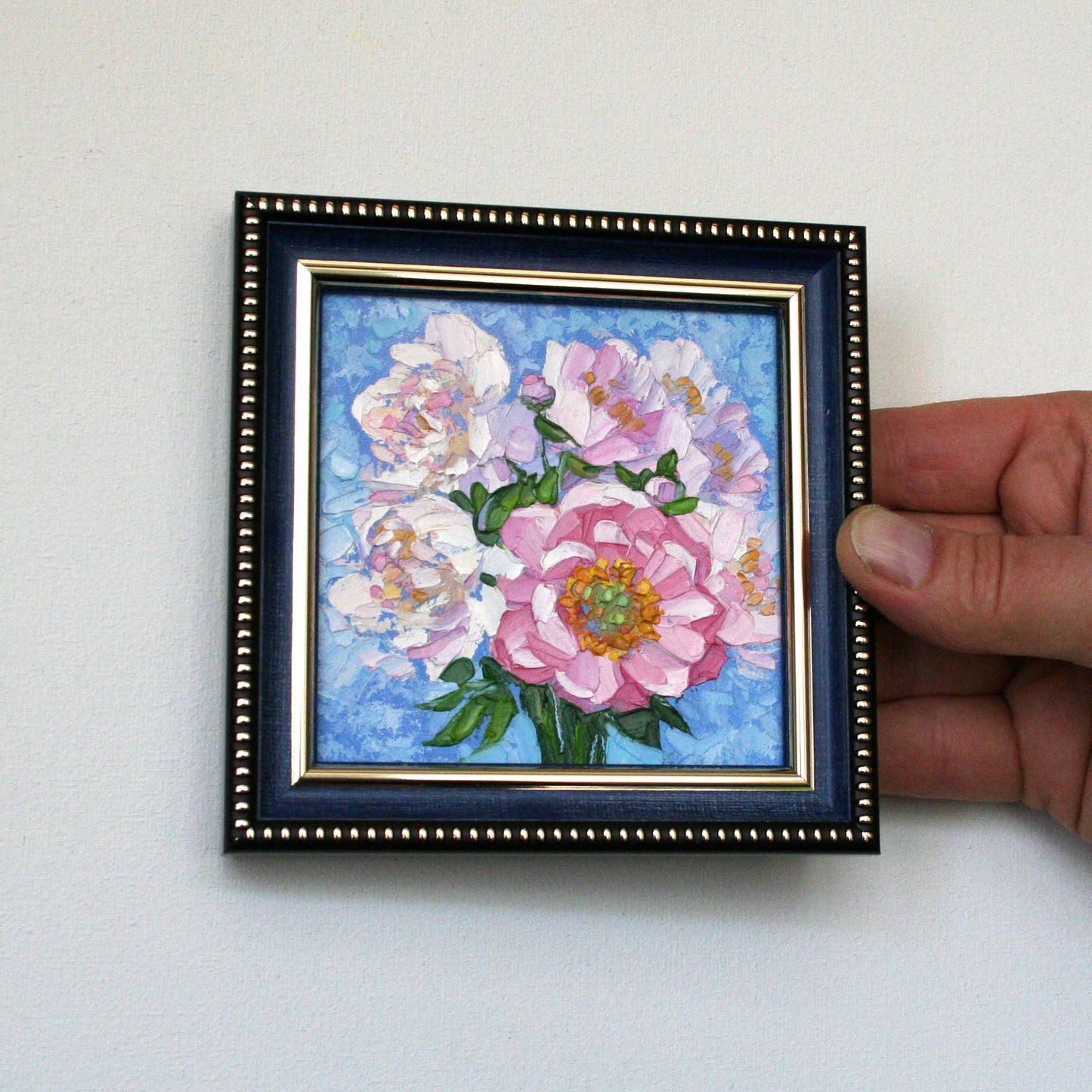 Small framed flower wall decor.