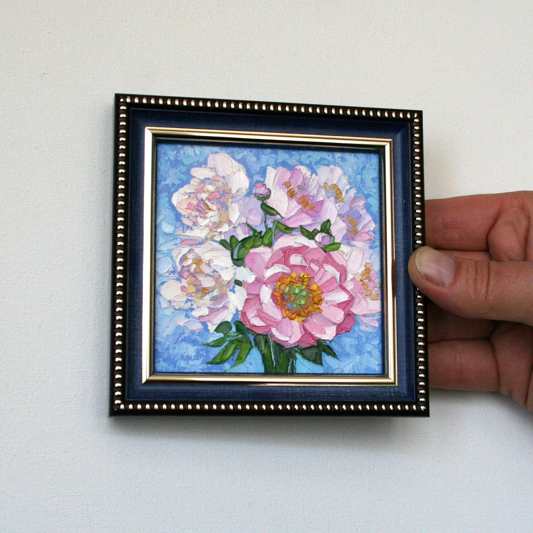 Small framed flower wall decor.
