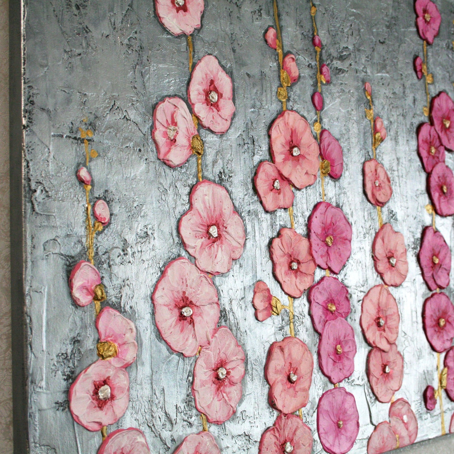 Macro shot of 3D sculptural floral texture on canvas, pink hollyhocks impasto art