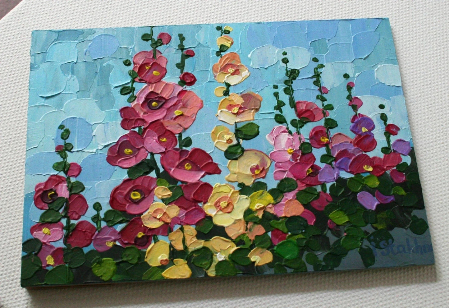 Mini painting of hollyhocks showing thick impasto texture, palette knife floral art by Iryna Stakhiv, tiny framed art