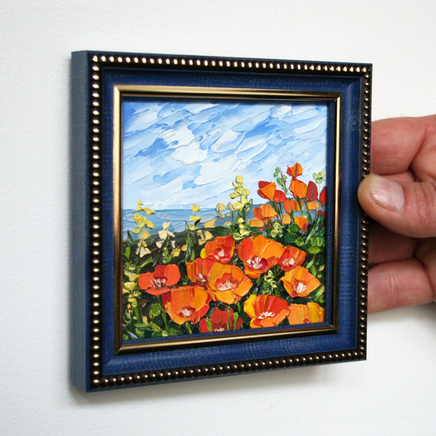 Miniature poppy oil painting in a blue frame, textured floral artwork, small California landscape painting.