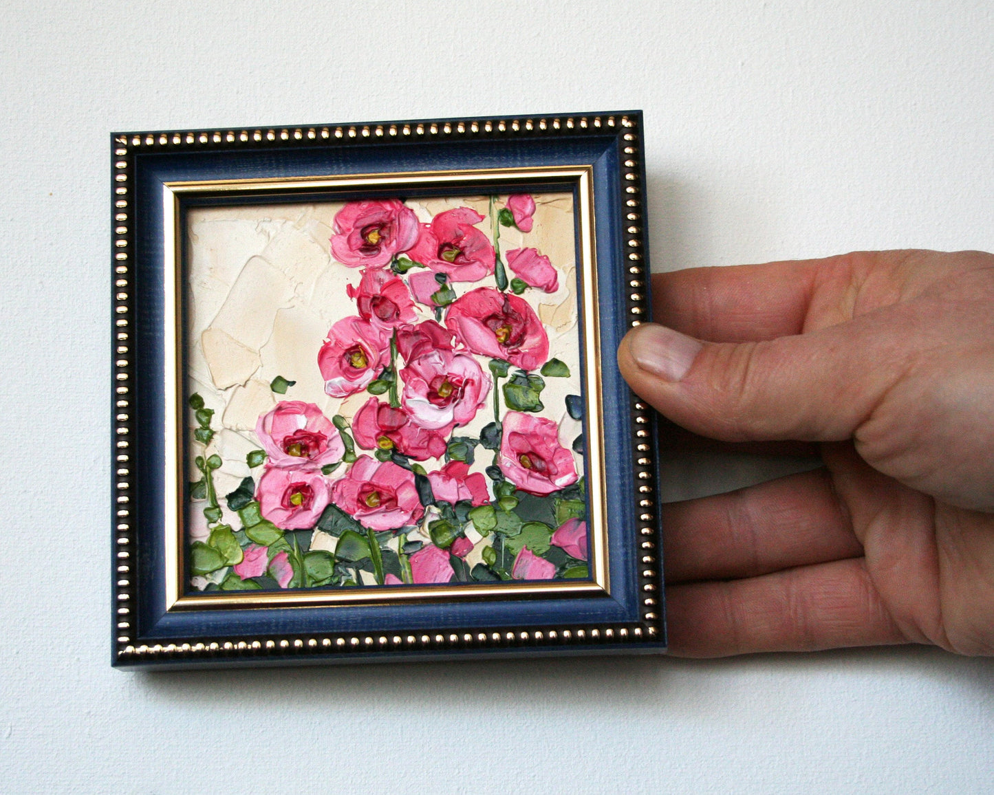 Original Hollyhock mini oil painting in blue frame by Iryna Stakhiv, palette knife impasto texture