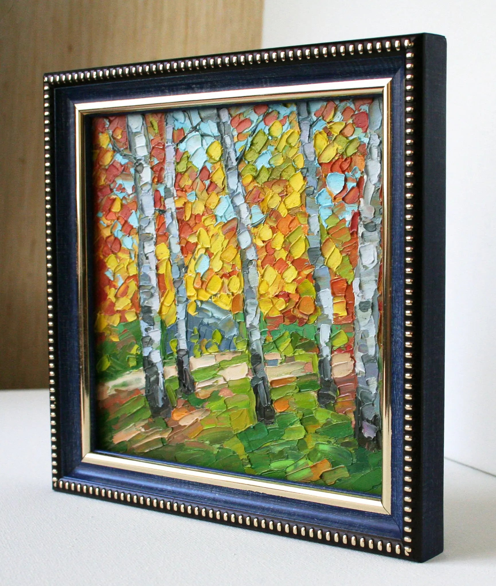 Side view of framed mini landscape painting, birch trees fall foliage, oil on panel