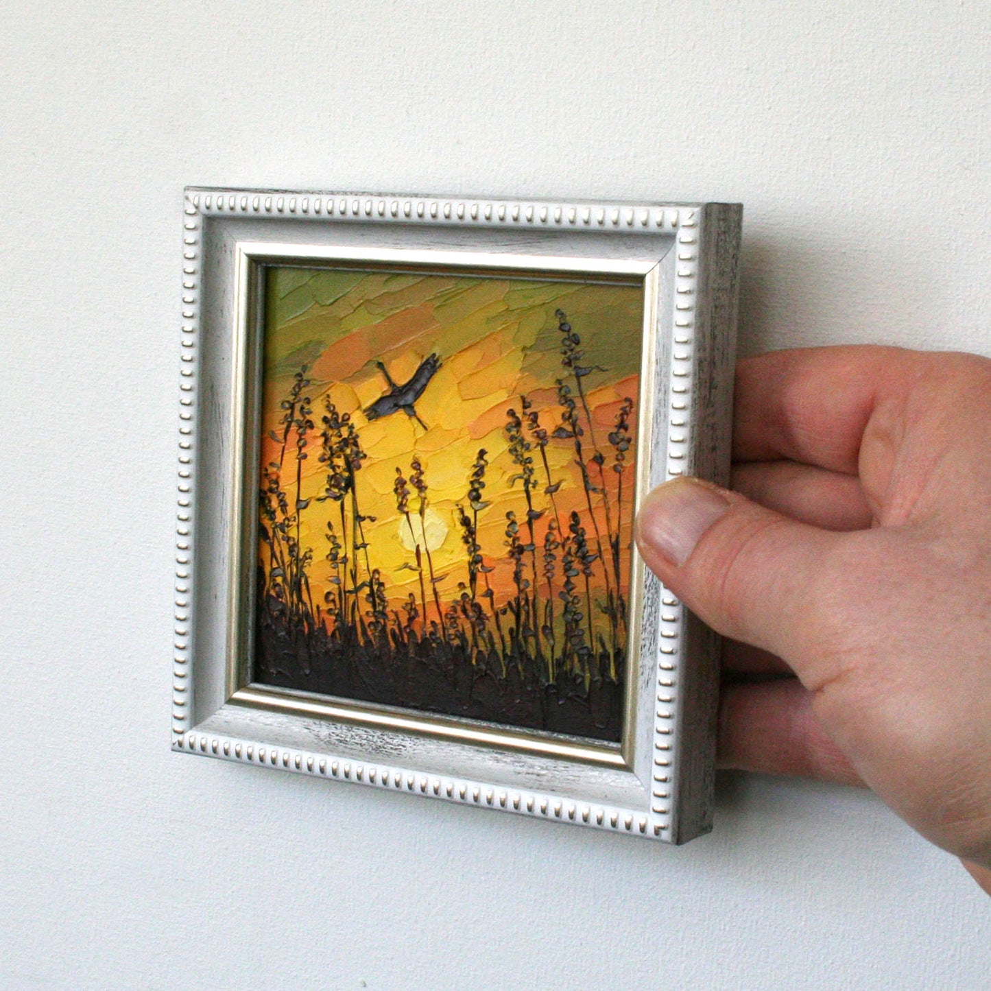 Side view of small framed stork sunset original oil painting with palette knife