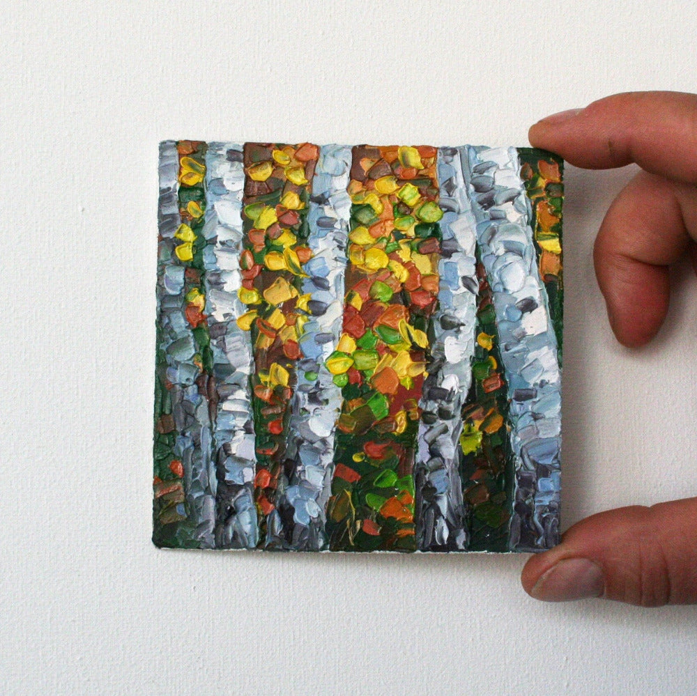 small painting of autumn trees with colorful leaves