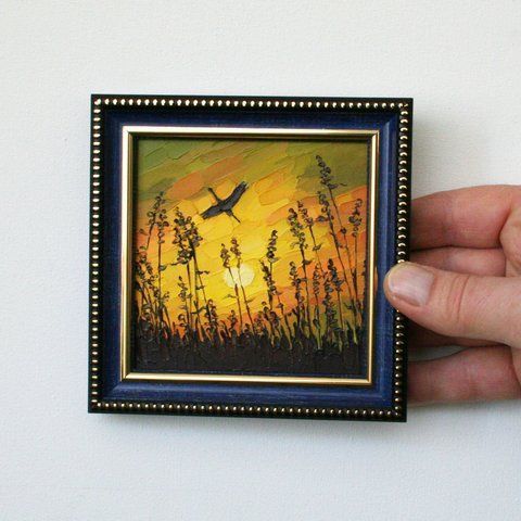 Framed mini oil painting of a sunset with silhouette plants and a bird, palette knife textured art