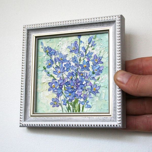Miniature oil painting of blue flowers with palette knife