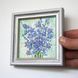 Miniature oil painting of blue flowers with palette knife